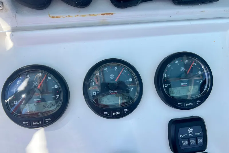  Yacht Photos Pics Dashboard of a 2008 Invincible 36 CC boat showing RPM gauges and controls.