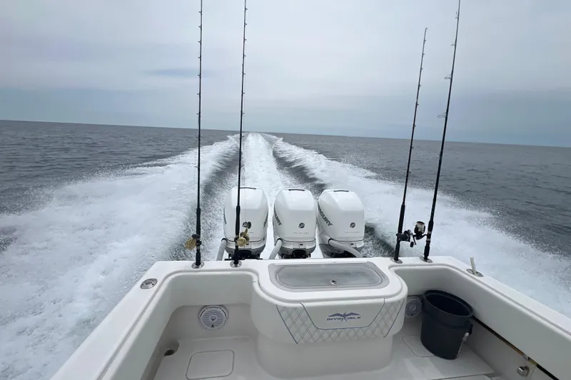  Yacht Photos Pics Invincible 36 CC boat, 2008 model, cruising with fishing rods and powerful engines.