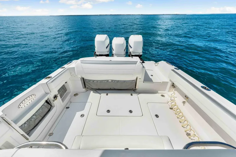  Yacht Photos Pics 2021 Nor-Tech 390 SS boat with triple engines on open sea.