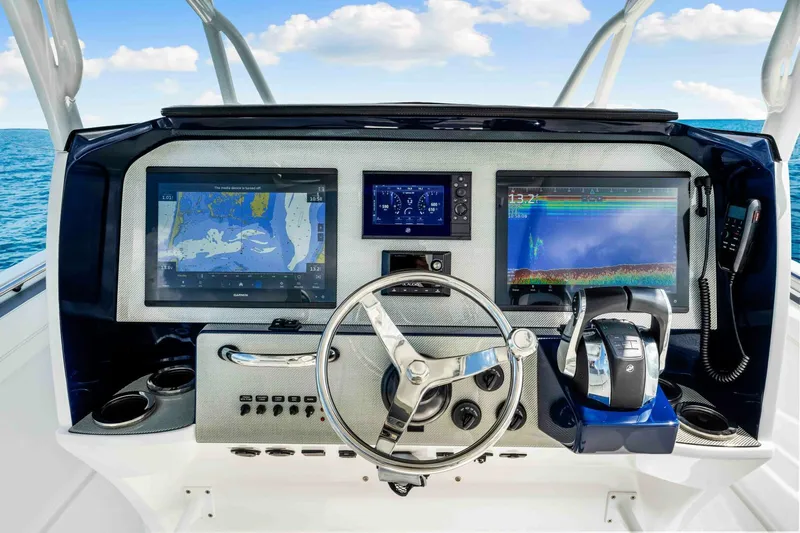  Yacht Photos Pics 2021 Nor-Tech 390 SS boat dashboard with advanced navigation and control systems.
