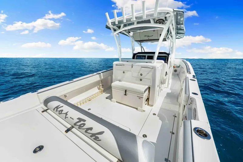  Yacht Photos Pics 2021 Nor-Tech 390 SS boat on open ocean under blue sky.