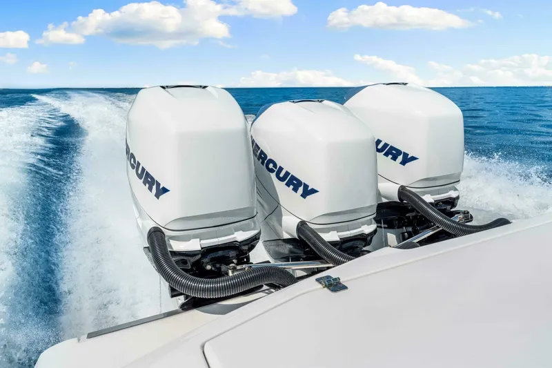  Yacht Photos Pics 2021 Nor-Tech 390 SS boat with triple Mercury outboard engines on open water.