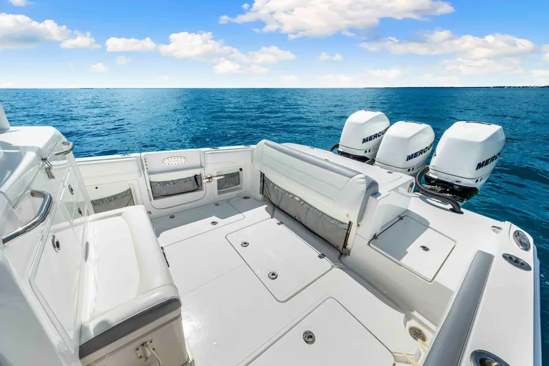  Yacht Photos Pics 2021 Nor-Tech 390 SS boat with triple Mercury engines on open sea.