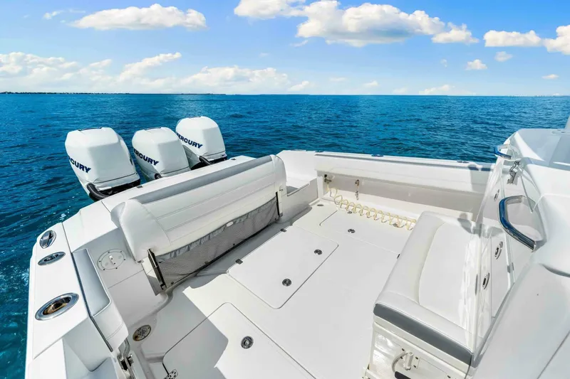  Yacht Photos Pics 2021 Nor-Tech 390 SS boat with triple Mercury engines on open sea.