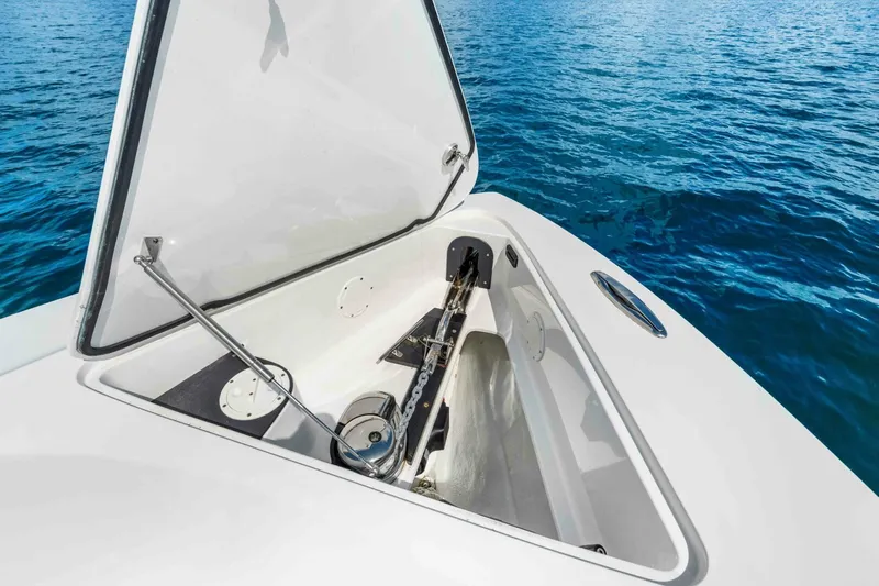  Yacht Photos Pics Open anchor compartment on 2021 Nor-Tech 390 SS boat, with ocean background.