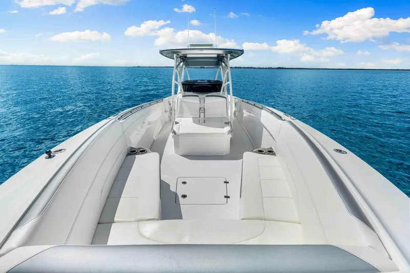  Yacht Photos Pics 2021 Nor-Tech 390 SS boat on clear blue water under a bright sky.