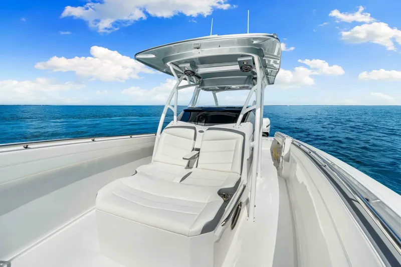  Yacht Photos Pics 2021 Nor-Tech 390 SS boat on open sea under clear blue sky.