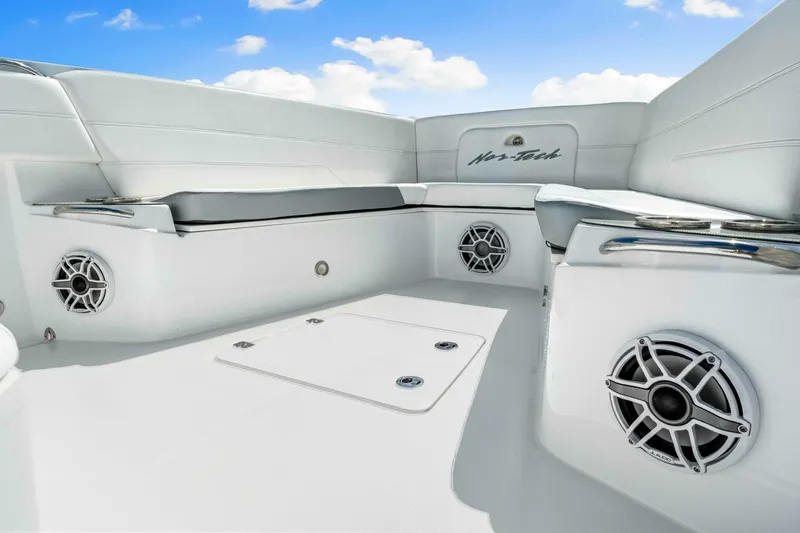  Yacht Photos Pics 2021 Nor-Tech 390 SS boat interior with white seating and built-in speakers.