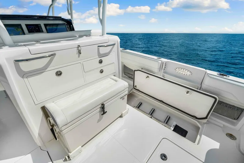  Yacht Photos Pics 2021 Nor-Tech 390 SS boat interior with storage compartments, open ocean view.