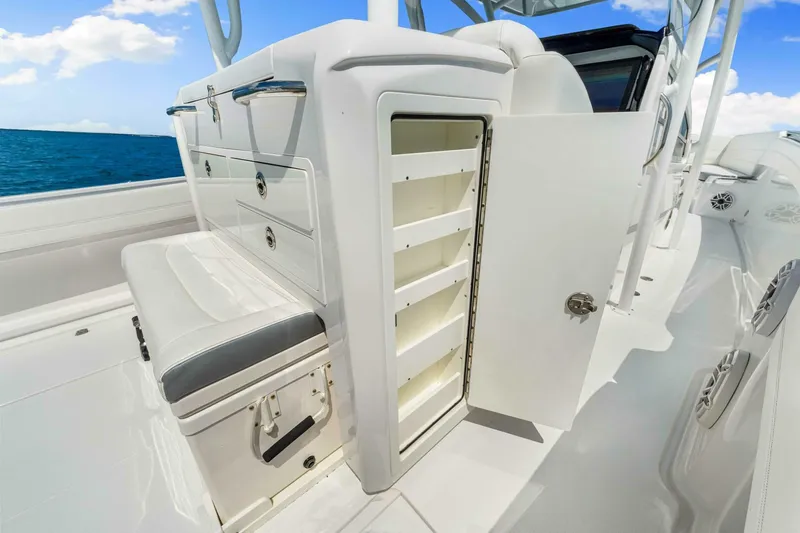  Yacht Photos Pics 2021 Nor-Tech 390 SS boat interior with open storage compartment and seating.