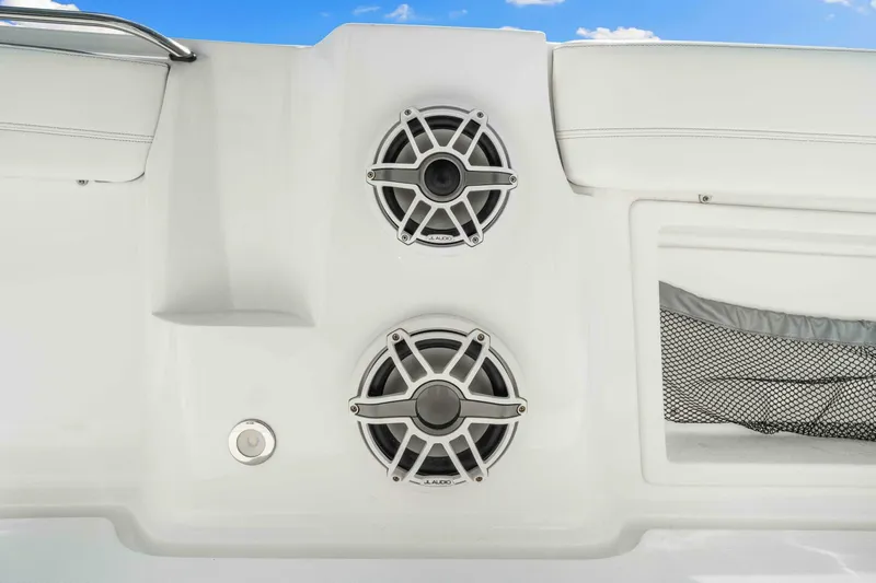  Yacht Photos Pics 2021 Nor-Tech 390 SS boat speakers and storage compartment against a clear blue sky.