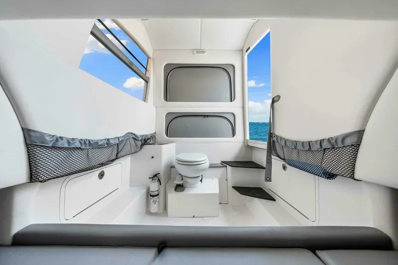  Yacht Photos Pics Interior of 2021 Nor-Tech 390 SS boat with toilet, ocean view, and storage nets.