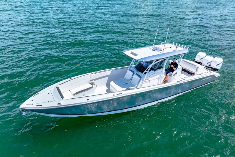  Yacht Photos Pics 2021 Nor-Tech 390 SS boat cruising on clear blue water.