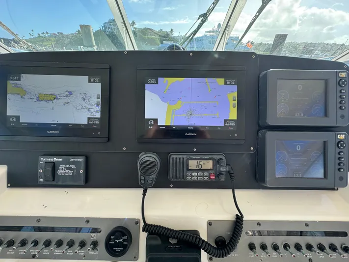 Lime Of Coconut Yacht Photos Pics Dashboard of a 2006 Rampage 38 Express boat with navigation screens.