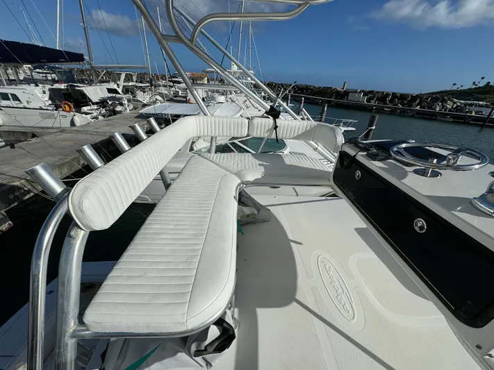 Lime Of Coconut Yacht Photos Pics 2006 Rampage 38 Express boat docked at marina, featuring white cushioned seating and fishing rod holders.