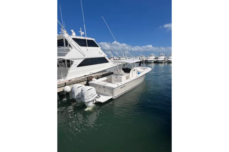 No Name Yacht Photos Pics 2016 Regulator 34 Center Console boat docked in marina under clear blue sky.