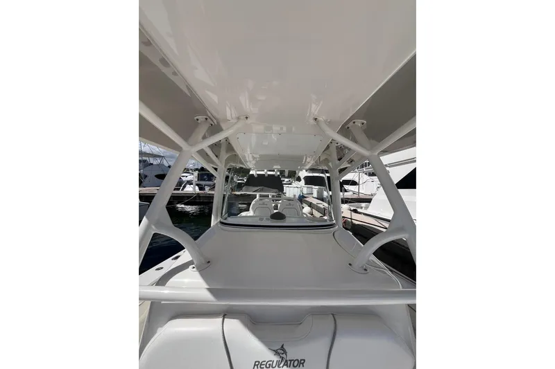 No Name Yacht Photos Pics 2016 Regulator 34 Center Console boat, docked, showcasing sleek design and spacious layout.