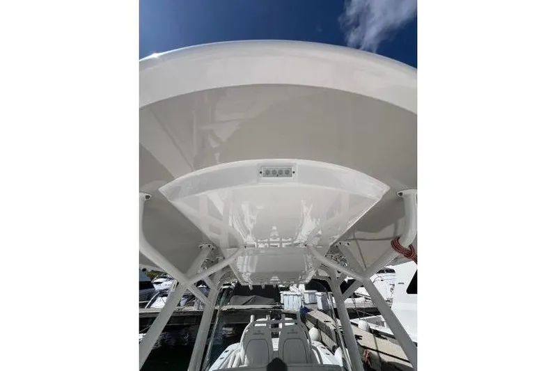 No Name Yacht Photos Pics 2016 Regulator 34 Center Console boat, view of the T-top and seating area.
