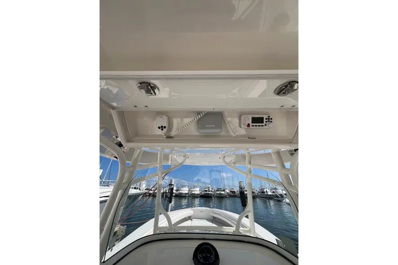 No Name Yacht Photos Pics 2016 Regulator 34 Center Console boat interior with electronics, docked at marina.
