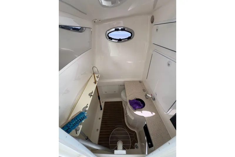 No Name Yacht Photos Pics 2016 Regulator 34 Center Console cabin interior with sink and storage.