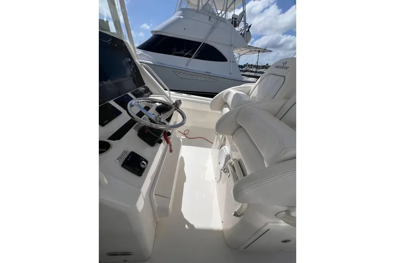 No Name Yacht Photos Pics 2016 Regulator 34 Center Console boat interior with steering wheel and seating.