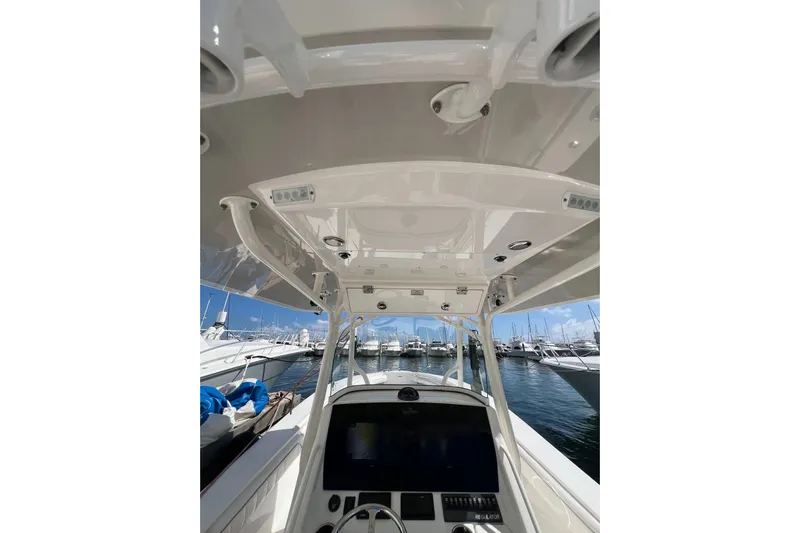 No Name Yacht Photos Pics 2016 Regulator 34 Center Console boat interior with helm, docked at marina.