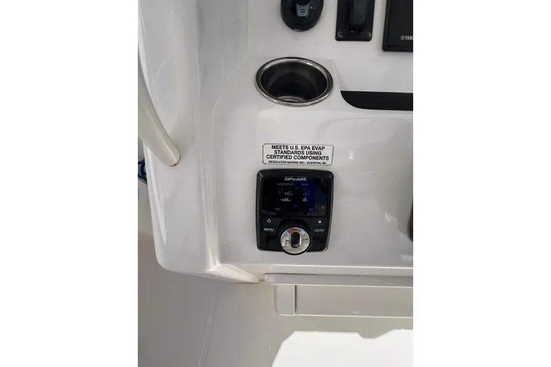 No Name Yacht Photos Pics 2016 Regulator 34 Center Console dashboard with control panel and cup holder.