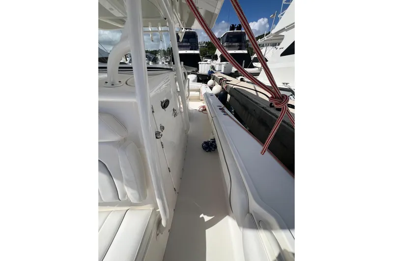 No Name Yacht Photos Pics 2016 Regulator 34 Center Console boat interior with white seating and docked yachts.