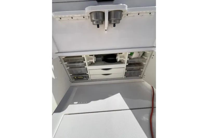No Name Yacht Photos Pics 2016 Regulator 34 Center Console storage compartment with organized drawers and containers.
