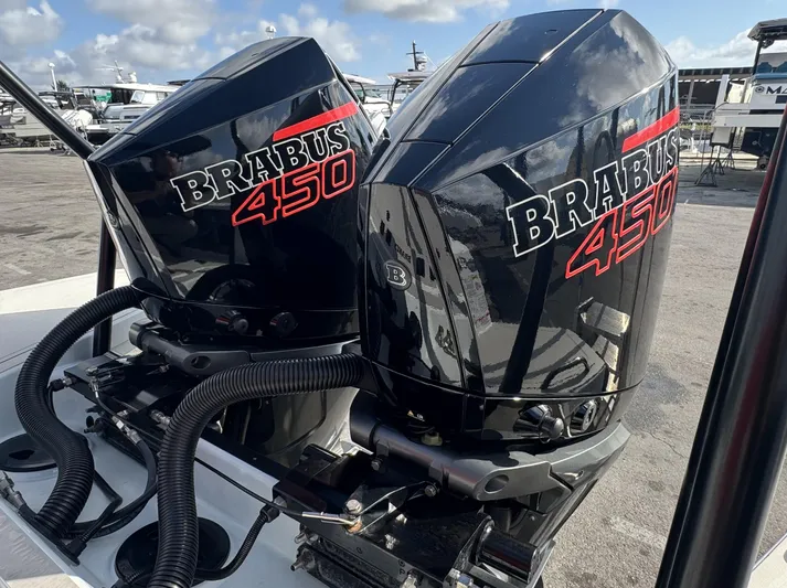 Kraken Yacht Photos Pics Twin BRABUS 450 engines on a 2023 Shadow 900 boat, docked under a clear sky.