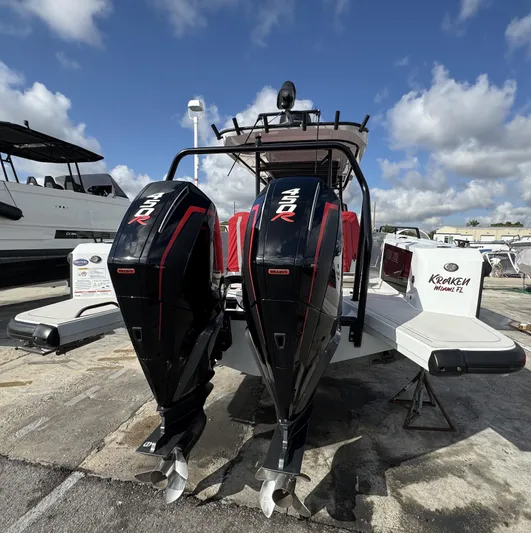 Kraken Yacht Photos Pics 2023 BRABUS Shadow 900 boat with dual engines, docked under a partly cloudy sky.