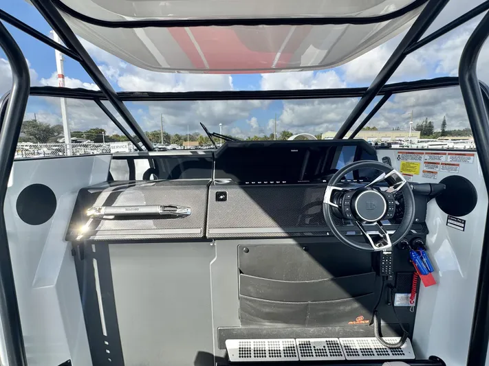 Kraken Yacht Photos Pics 2023 BRABUS Shadow 900 cockpit with modern steering and dashboard, showcasing sleek design.