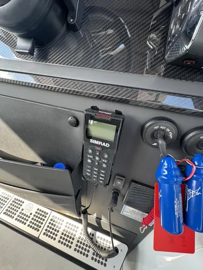 Kraken Yacht Photos Pics Control panel of 2023 BRABUS Shadow 900 with Simrad marine radio and safety equipment.