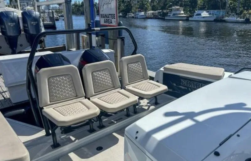 Kraken Yacht Photos Pics 2023 BRABUS Shadow 900 boat interior with seating, docked near water.