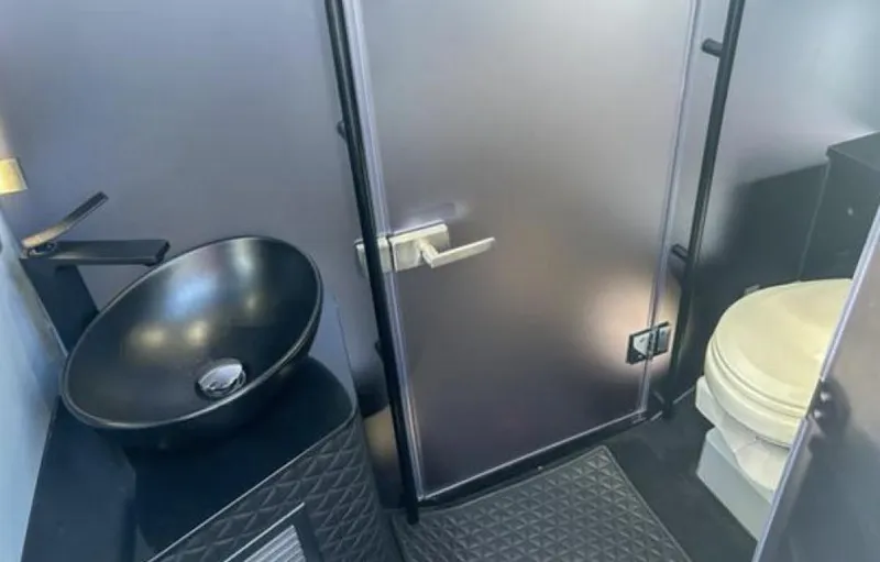 Kraken Yacht Photos Pics 2023 BRABUS Shadow 900 bathroom interior with modern sink and toilet.