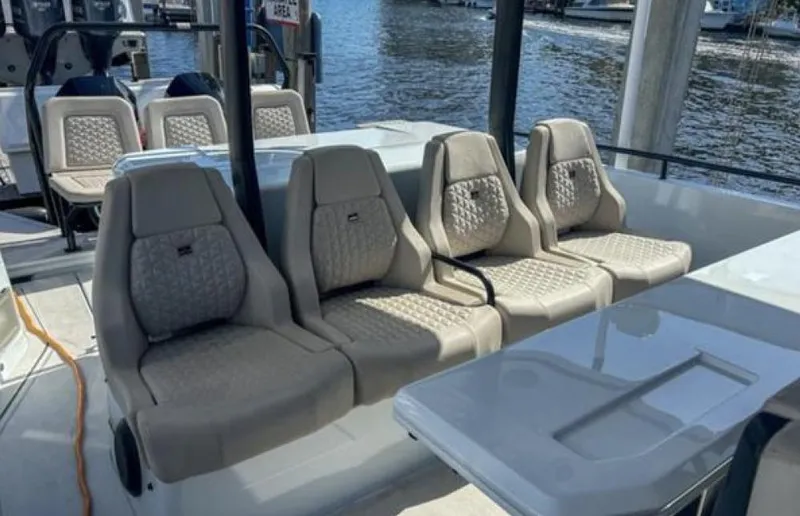 Kraken Yacht Photos Pics Luxurious seating on a 2023 BRABUS Shadow 900 boat, featuring elegant beige upholstery.