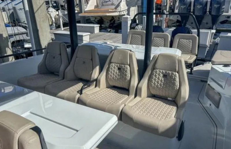 Kraken Yacht Photos Pics Luxurious seating on 2023 BRABUS Shadow 900 boat, featuring elegant quilted upholstery.