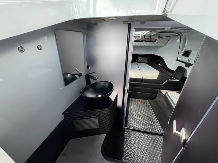 Kraken Yacht Photos Pics Interior of 2023 BRABUS Shadow 900 ST, featuring modern bathroom and cabin design.