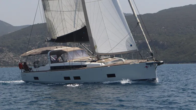 Nick Of Time III Yacht Photos Pics Sailing yacht Beneteau Oceanis 55, 2015 model, cruising on open water.