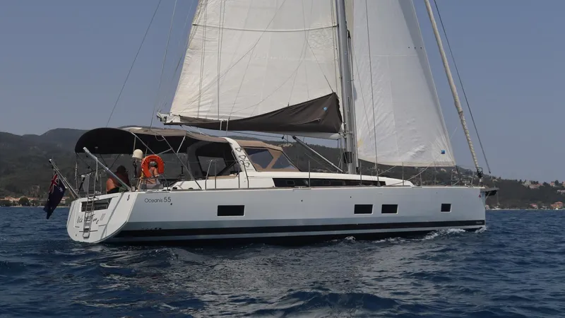 Nick Of Time III Yacht Photos Pics Sailing yacht Beneteau Oceanis 55, 2015 model, cruising on open water.
