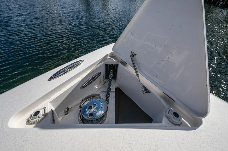  Yacht Photos Pics 2019 Intrepid 407 Nomad FE anchor compartment with open hatch, showcasing marine hardware.