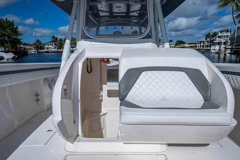  Yacht Photos Pics 2019 Intrepid 407 Nomad FE boat interior with seating and open cabin door.