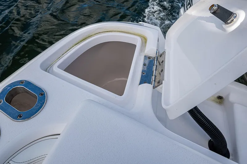  Yacht Photos Pics Open storage compartment on 2019 Intrepid 407 Nomad FE boat, near water surface.
