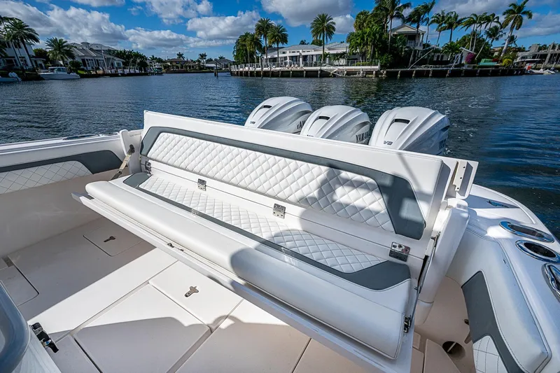  Yacht Photos Pics 2019 Intrepid 407 Nomad FE boat with luxurious seating and powerful engines on a scenic waterway.