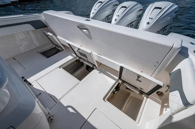  Yacht Photos Pics 2019 Intrepid 407 Nomad FE boat with open storage compartments and Yamaha engines.
