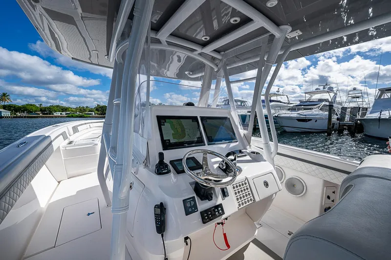 Yacht Photos Pics 2019 Intrepid 407 Nomad FE boat cockpit with navigation system, docked at marina.