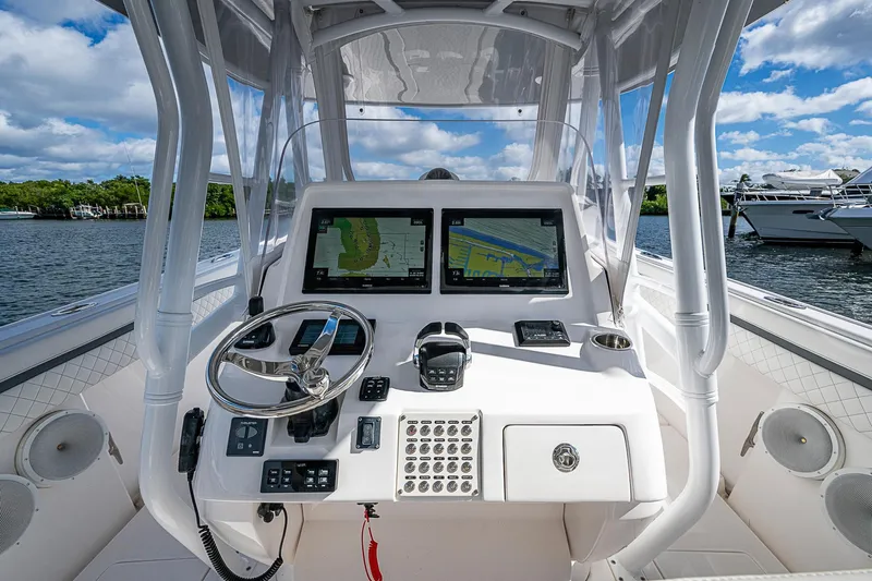  Yacht Photos Pics 2019 Intrepid 407 Nomad FE boat helm with dual navigation screens and steering wheel.