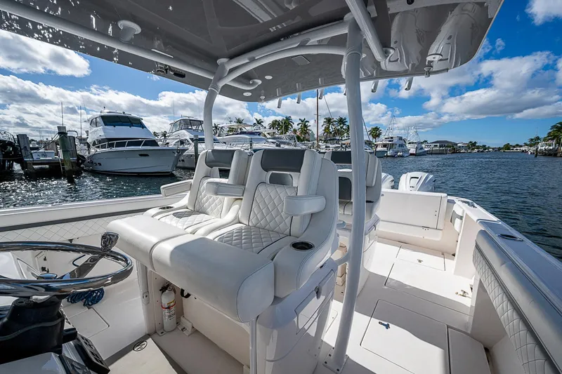  Yacht Photos Pics 2019 Intrepid 407 Nomad FE boat interior with luxurious seating at marina.