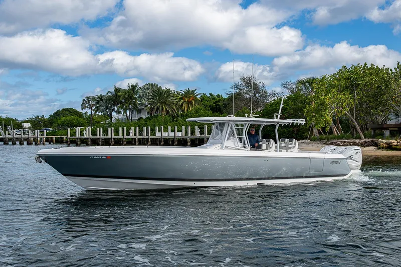  Yacht Photos Pics 2019 Intrepid 407 Nomad FE boat cruising on a scenic waterway.