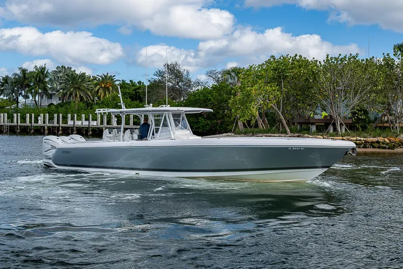  Yacht Photos Pics 2019 Intrepid 407 Nomad FE boat cruising on a scenic waterway.